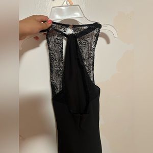 you can’t see very well but the front has a tie and the back is very cute lace.